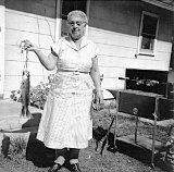 Elva Dooley with fish...not looking too pleased.